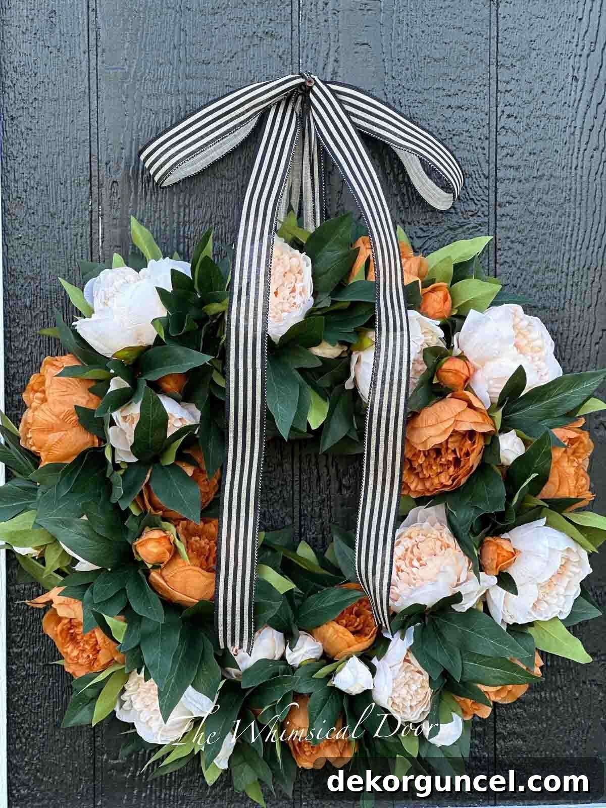 Sophisticated coffee and cream peony wreath, complete with a striped ribbon for elegant autumn display on your front door.