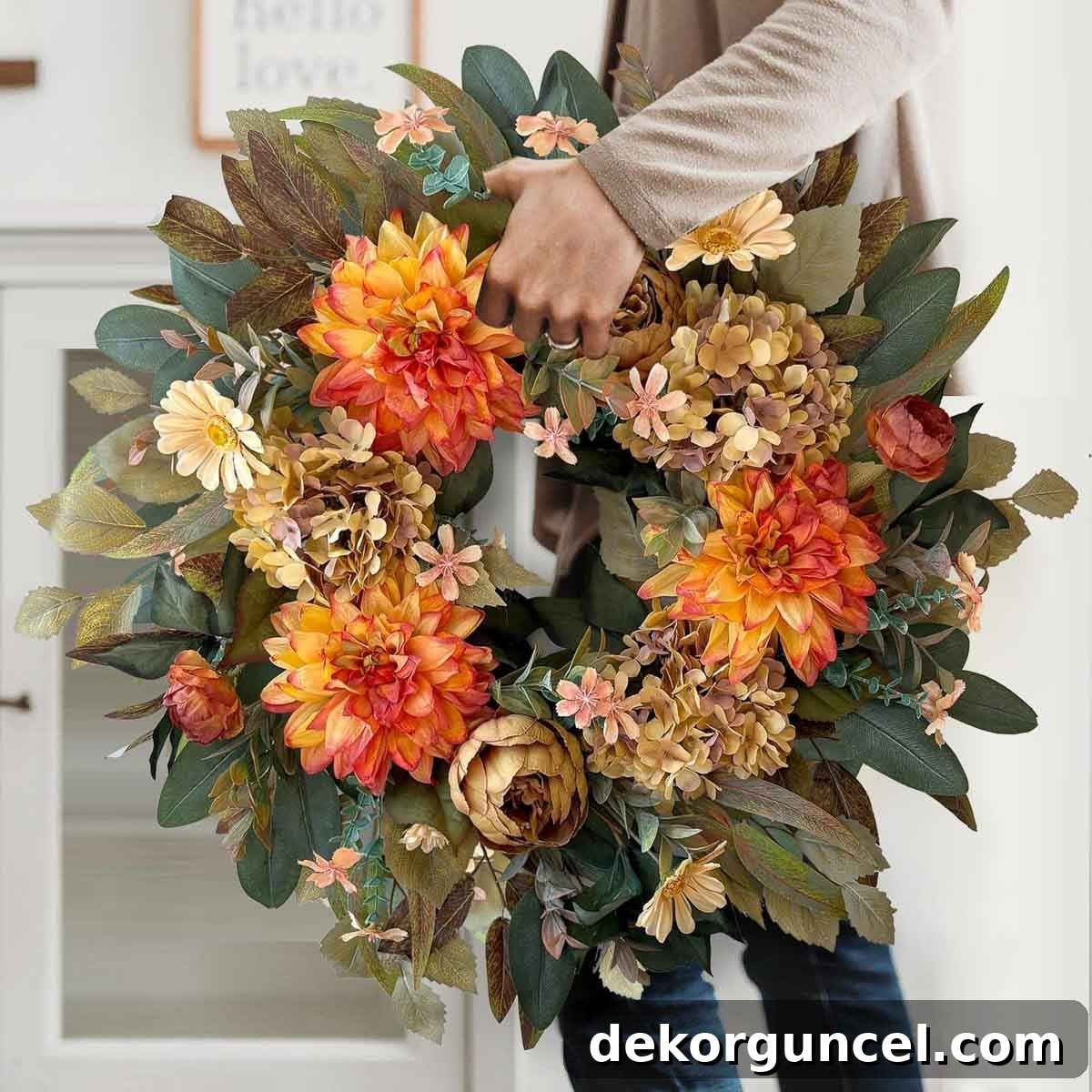 Budget-conscious floral wreath featuring an elegant arrangement of flowers in soft, muted autumn tones.