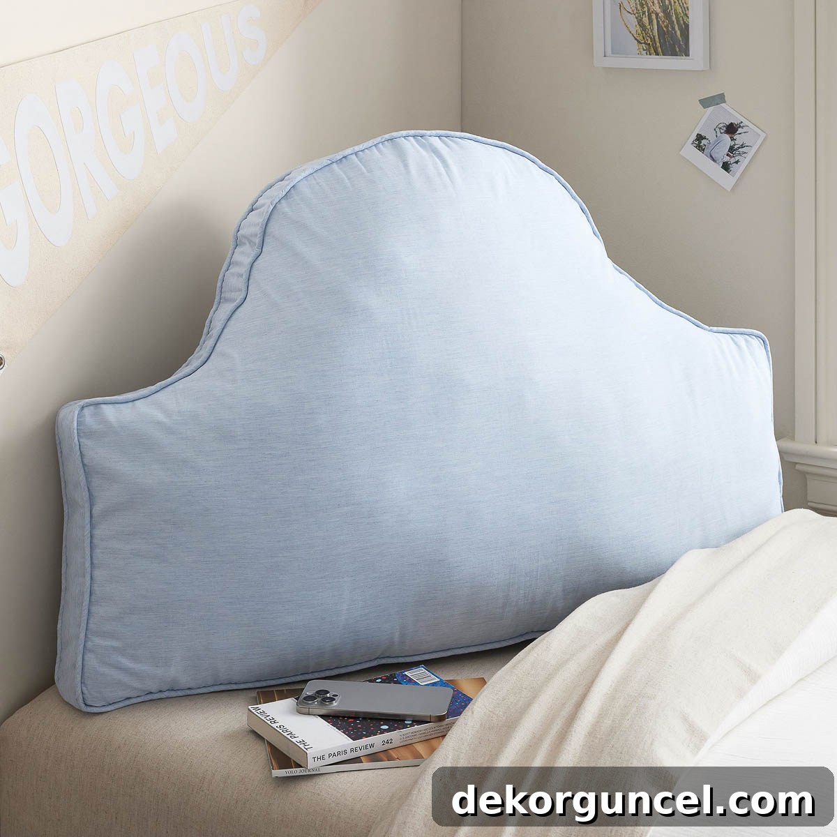 Headboard pillow adding comfort to a dorm room bed setup