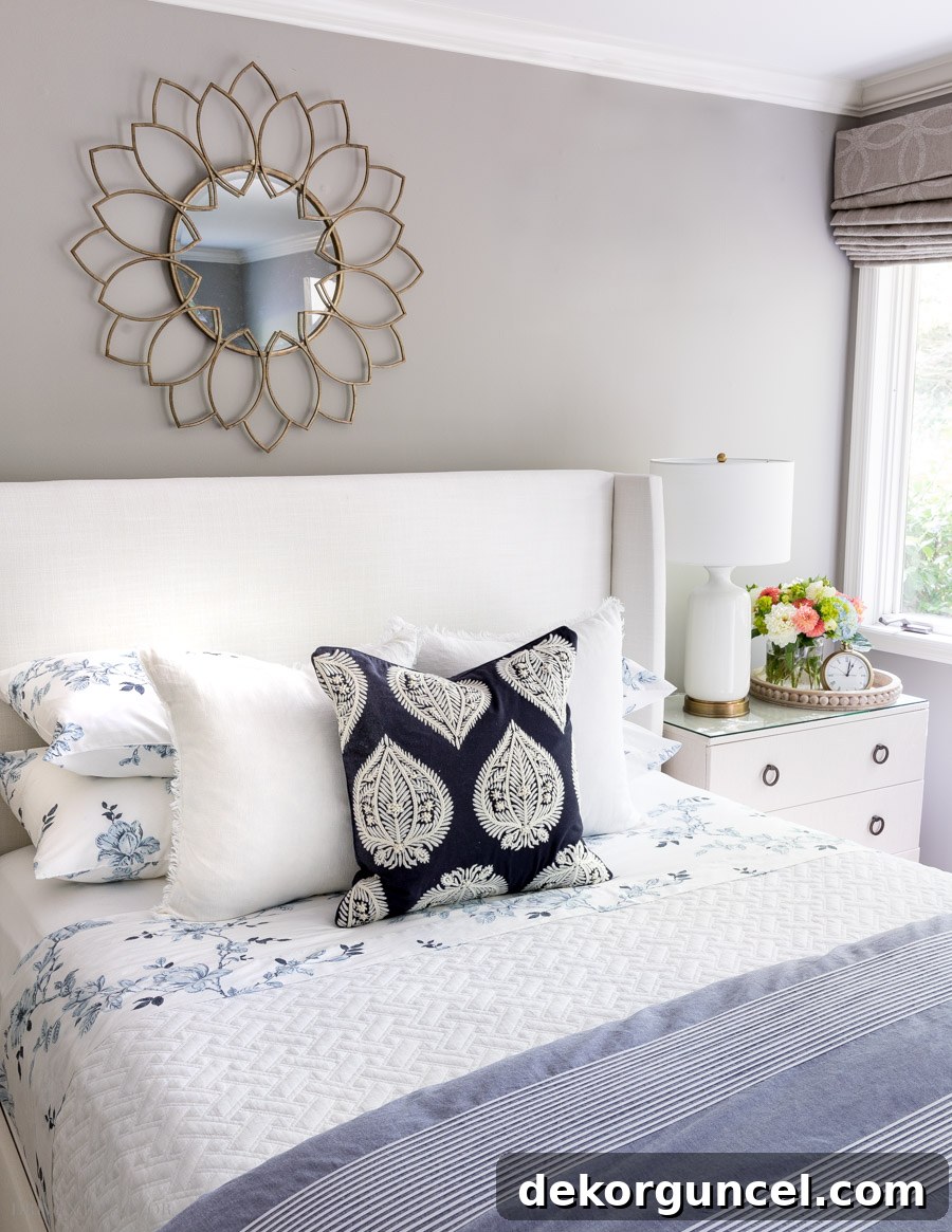 Love how she stacked the sleeping pillows behind the decorative pillows on this bed! Lots of other pillow arranging ideas in this post!