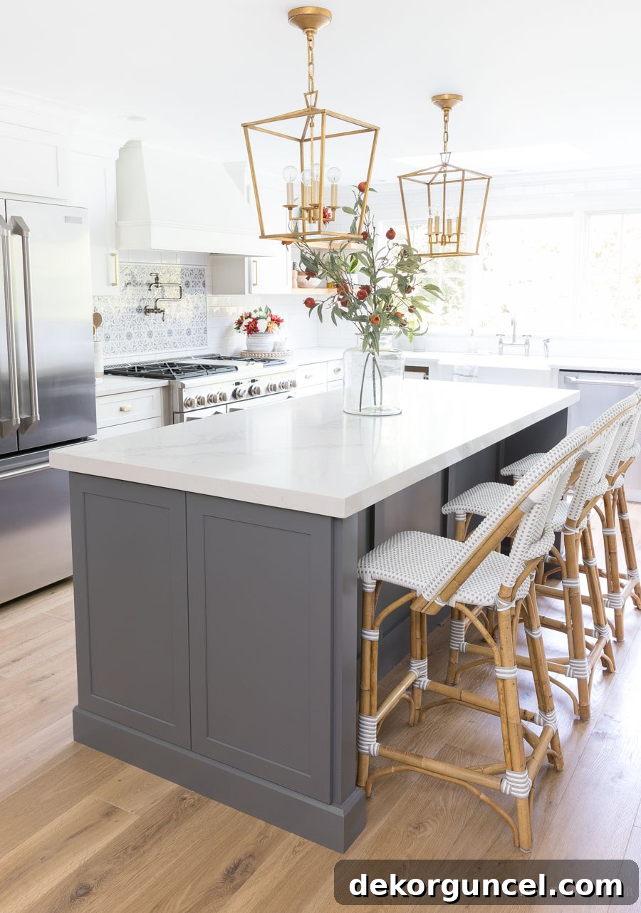 Optimal Pendant Light Height and Spacing for Kitchen Islands 5 SUCH helpful tips about hanging lights over a kitchen island including how many to use, how far apart, and more!