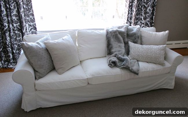 The Ultimate IKEA EKTORP Sofa Upgrade 7 Chaise cushion on ektorp sofa with fur blanket