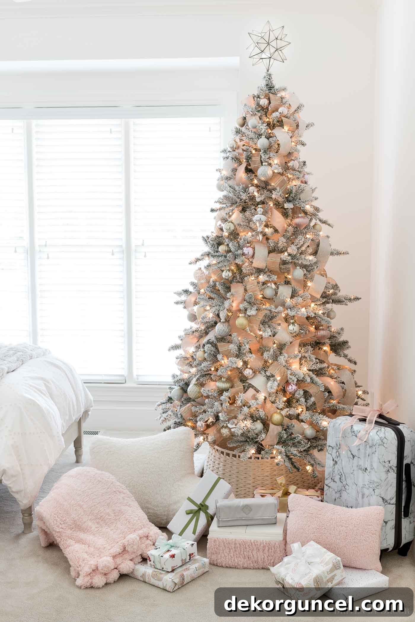 The prettiest blush Christmas tree, showcasing a variety of thoughtful Christmas gift ideas for teen girls from this holiday guide.