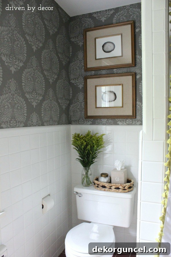 Affordable Bathroom Renovation Ideas 14 Full view of bathroom showing stenciled walls and DIY art above toilet