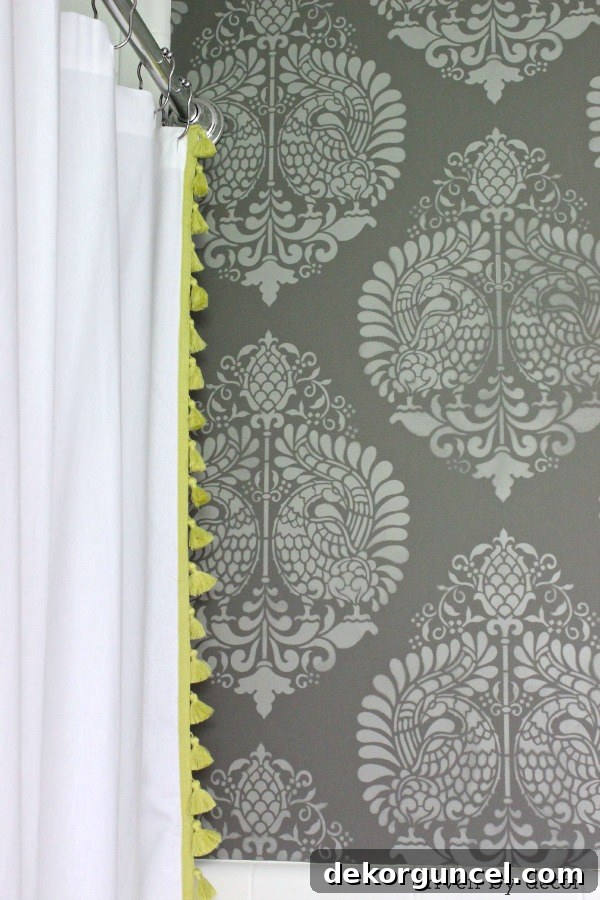 Affordable Bathroom Renovation Ideas 16 Stylish tasseled shower curtain in a newly remodeled bathroom