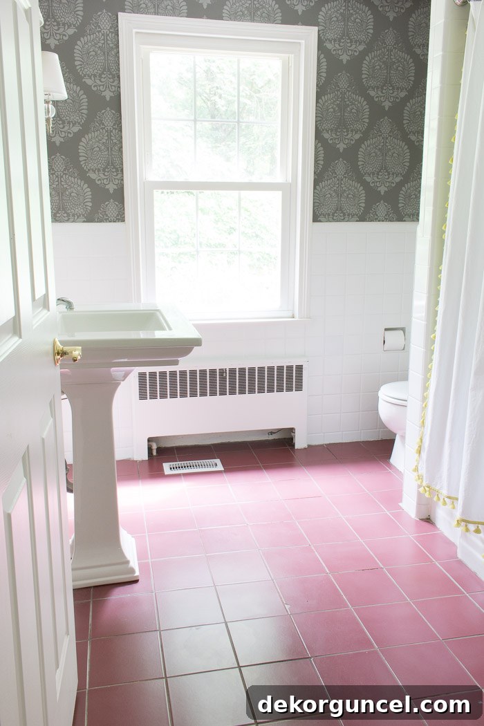 Affordable Bathroom Renovation Ideas 17 Before image of bathroom showing ugly red ceramic floor tiles exposed after carpet removal