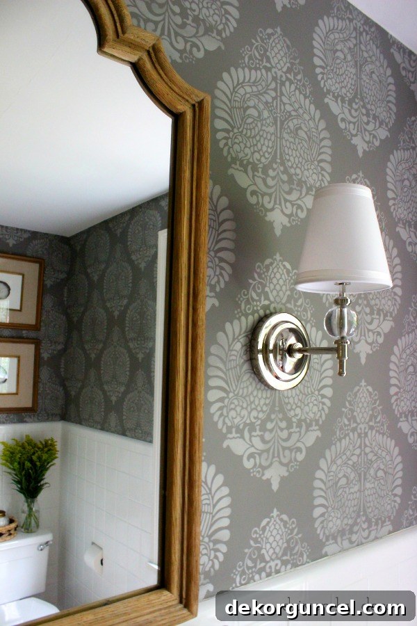 Affordable Bathroom Renovation Ideas 5 Restoration Hardware Wilshire Sconces flanking a mirror in a newly stenciled bathroom