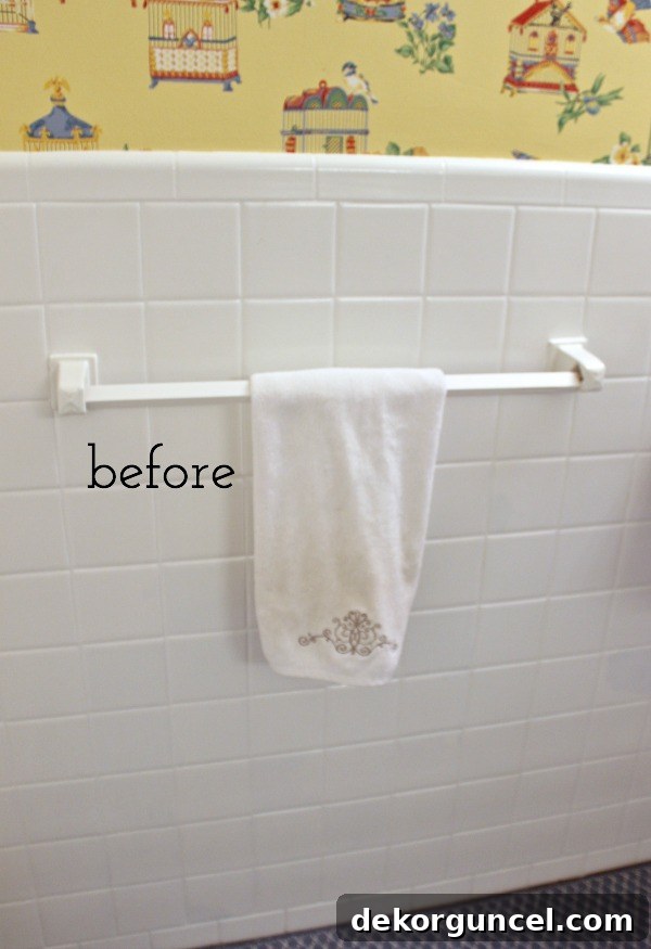 Affordable Bathroom Renovation Ideas 8 Old plastic towel bar with fixed ceramic ends before renovation