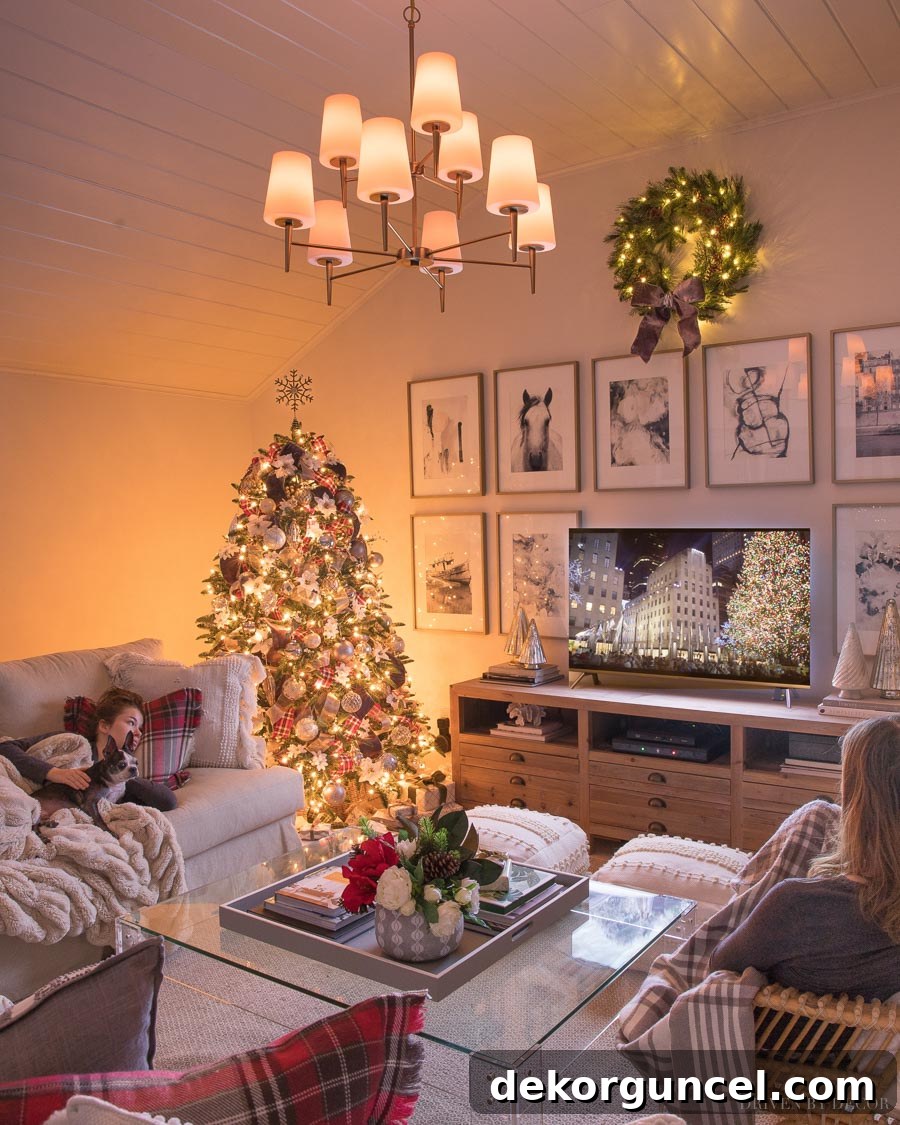 Our family room, transformed into a super cozy Christmas haven with a twinkling tree, soft lighting, and festive accents.