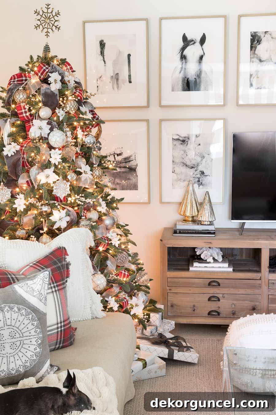 A close-up of our magnificent Christmas tree, showcasing the elegant combination of soft gray velvet and festive red plaid ribbons.