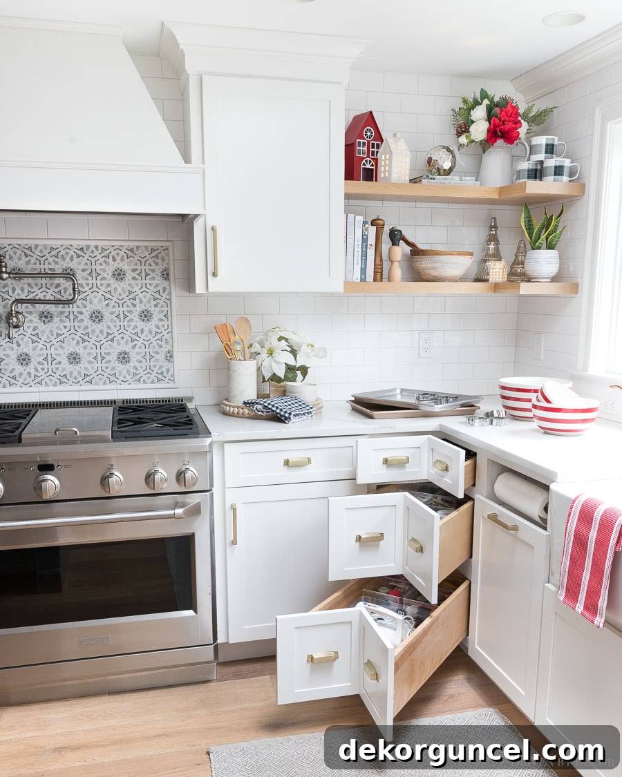 Our bright and modern kitchen, infused with cheerful pops of red decor for a festive Christmas atmosphere.