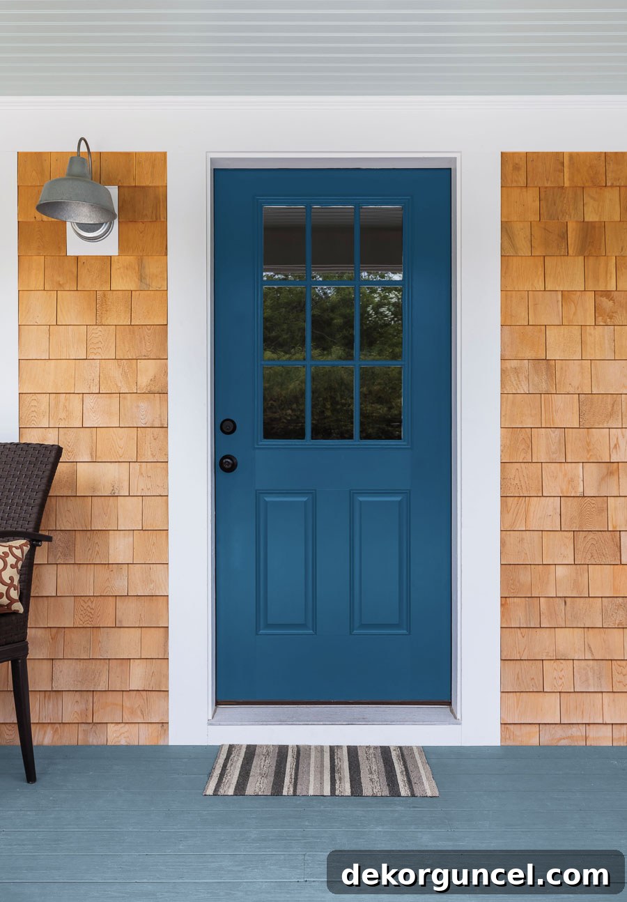 PPG's Chinese Porcelain, a blend of cobalt and moody ink blue, shines as an elegant accent color, perfect for front doors and statement pieces.