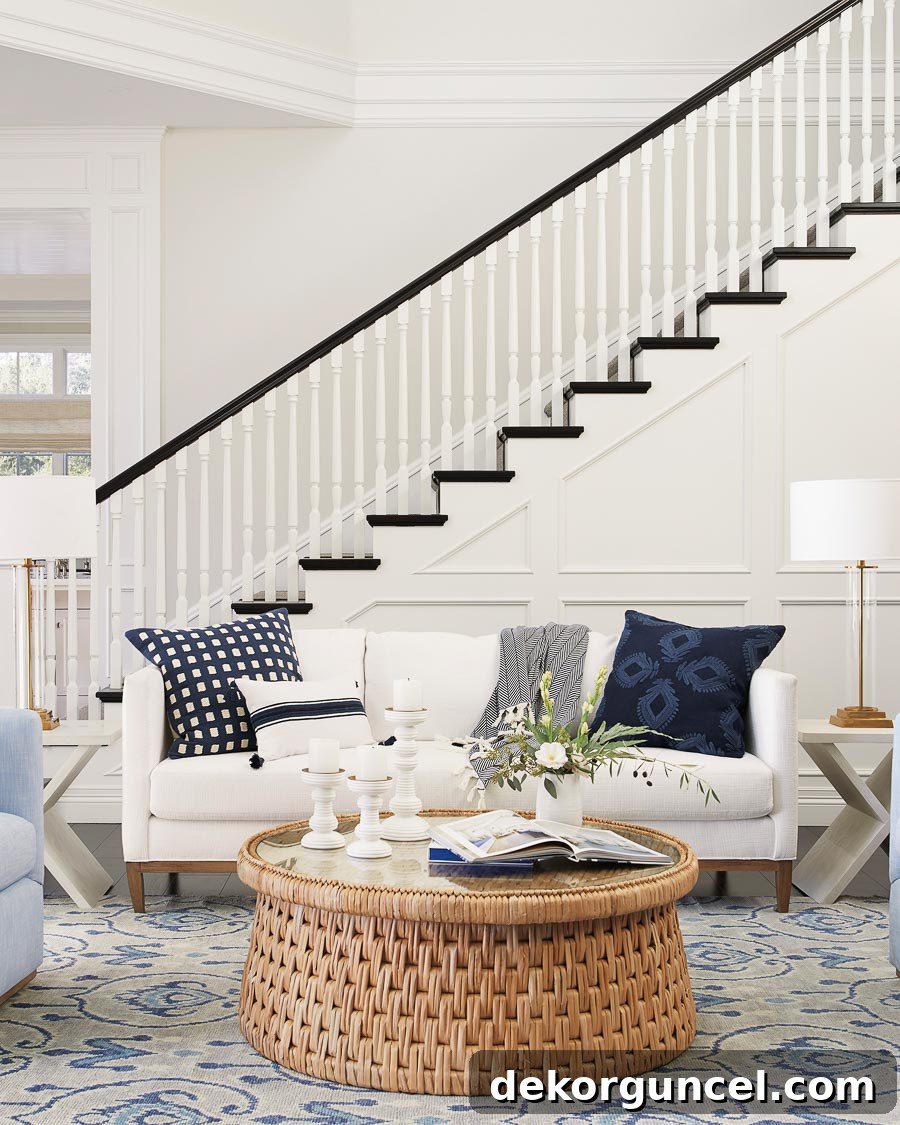 6 Home Decor Trends Shaping 2020 7 A stunning round woven coffee table with a glass top, highlighting the popular rattan and caned furniture trend in 2020 home decor.