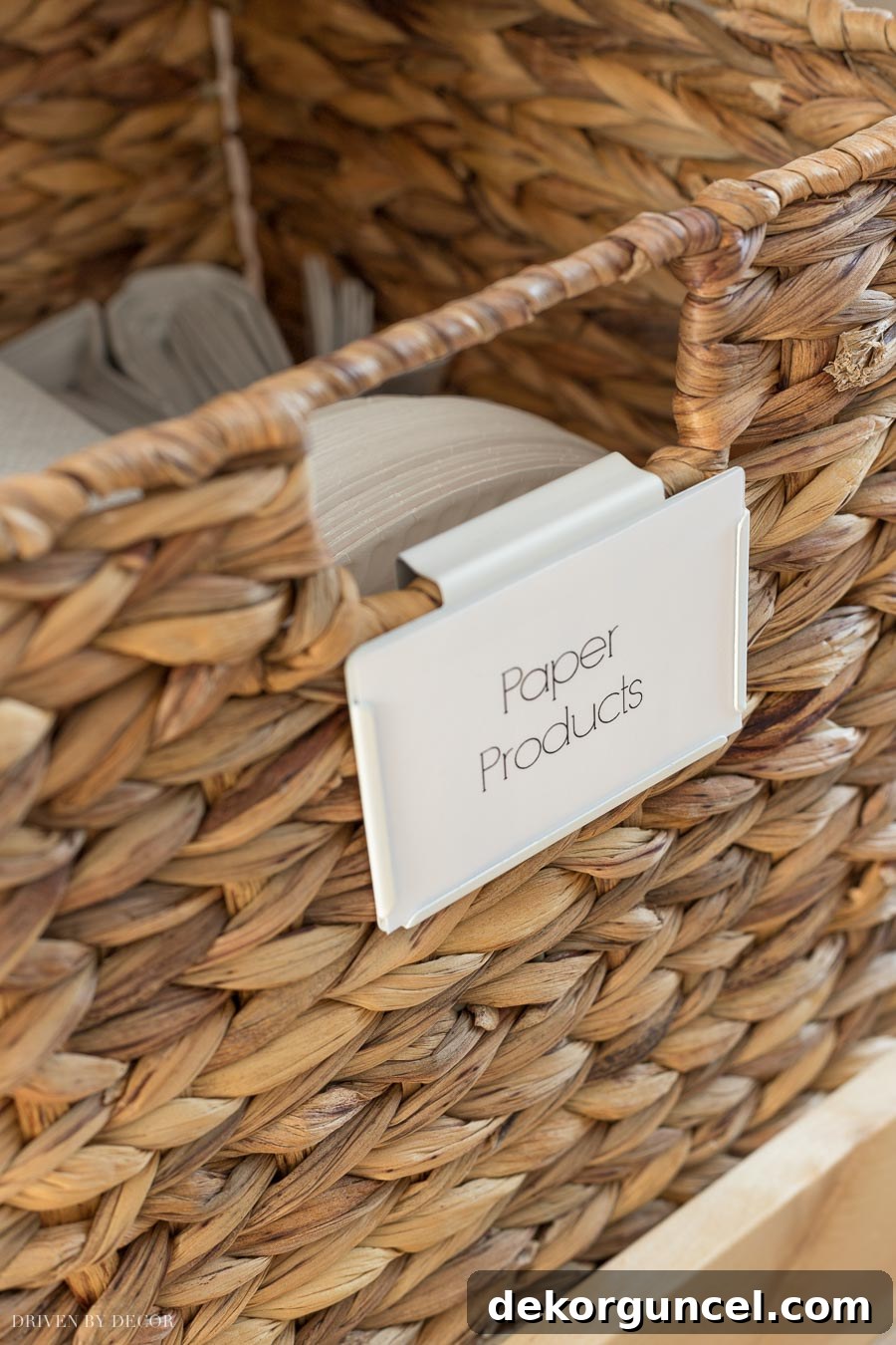 Stylish bin clip label holders attached to woven baskets, clearly identifying pantry contents