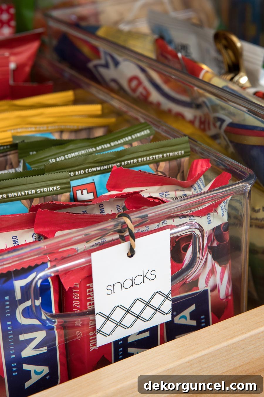 Printable tags on various pantry bins, showcasing a systematic approach to food organization