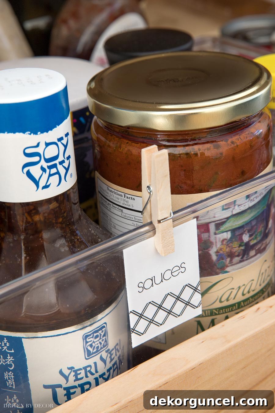 Personalized pantry labels affixed with clothespins, ensuring every item has its designated place
