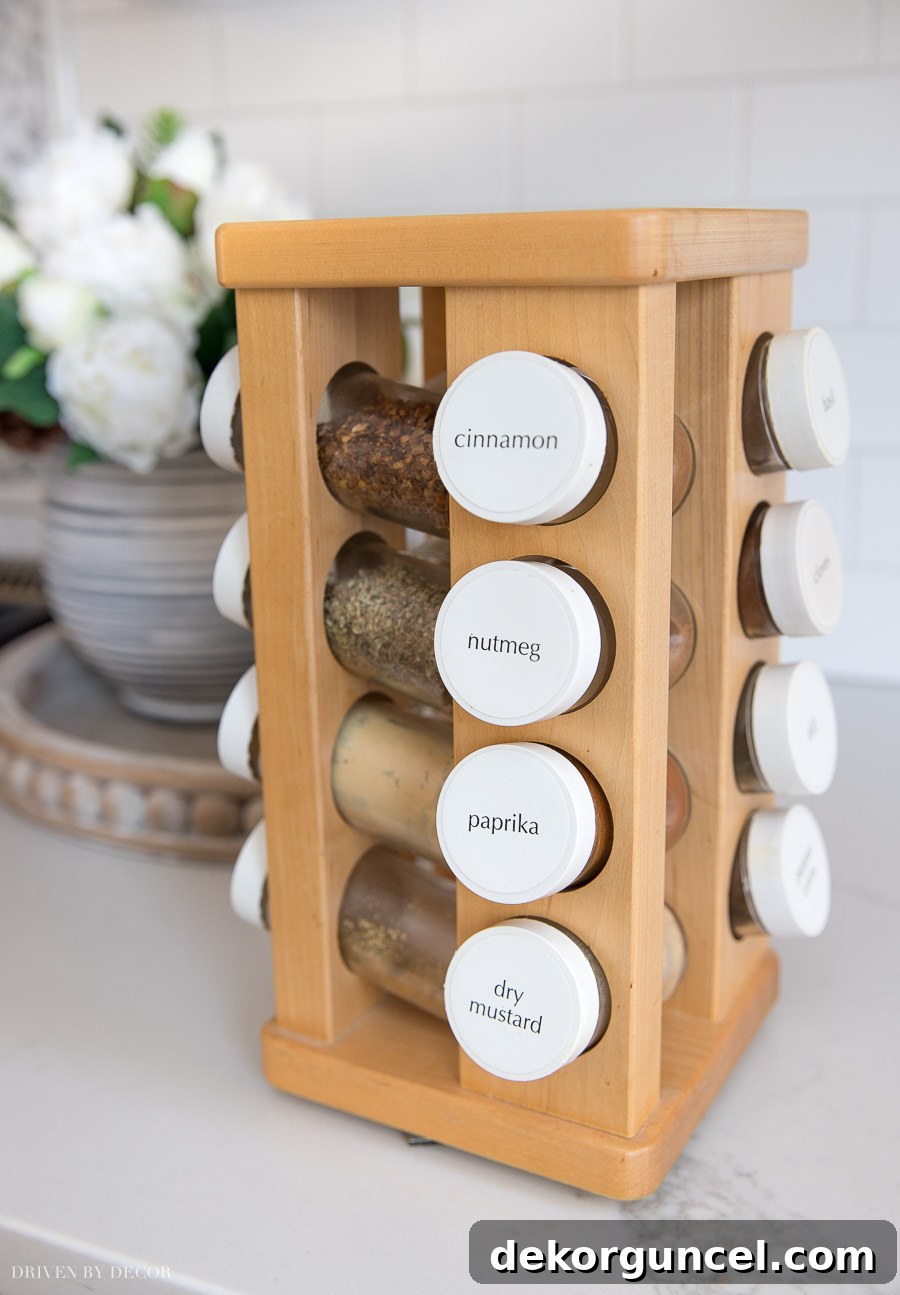 Revolving spice rack keeping a variety of spices neatly arranged and visible within the pantry