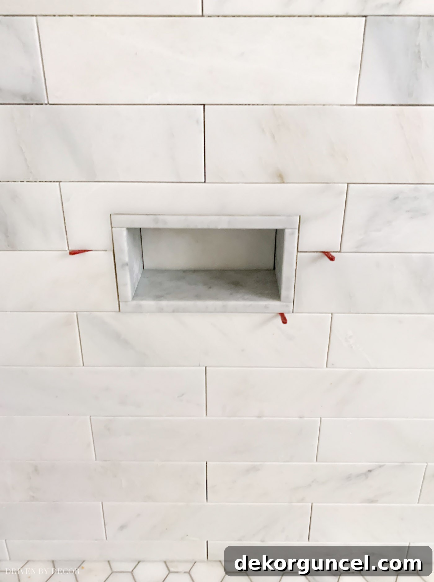 Our Bathroom Remodel Progress 11 Love the idea of a foot rest niche like this for shaving in the shower!