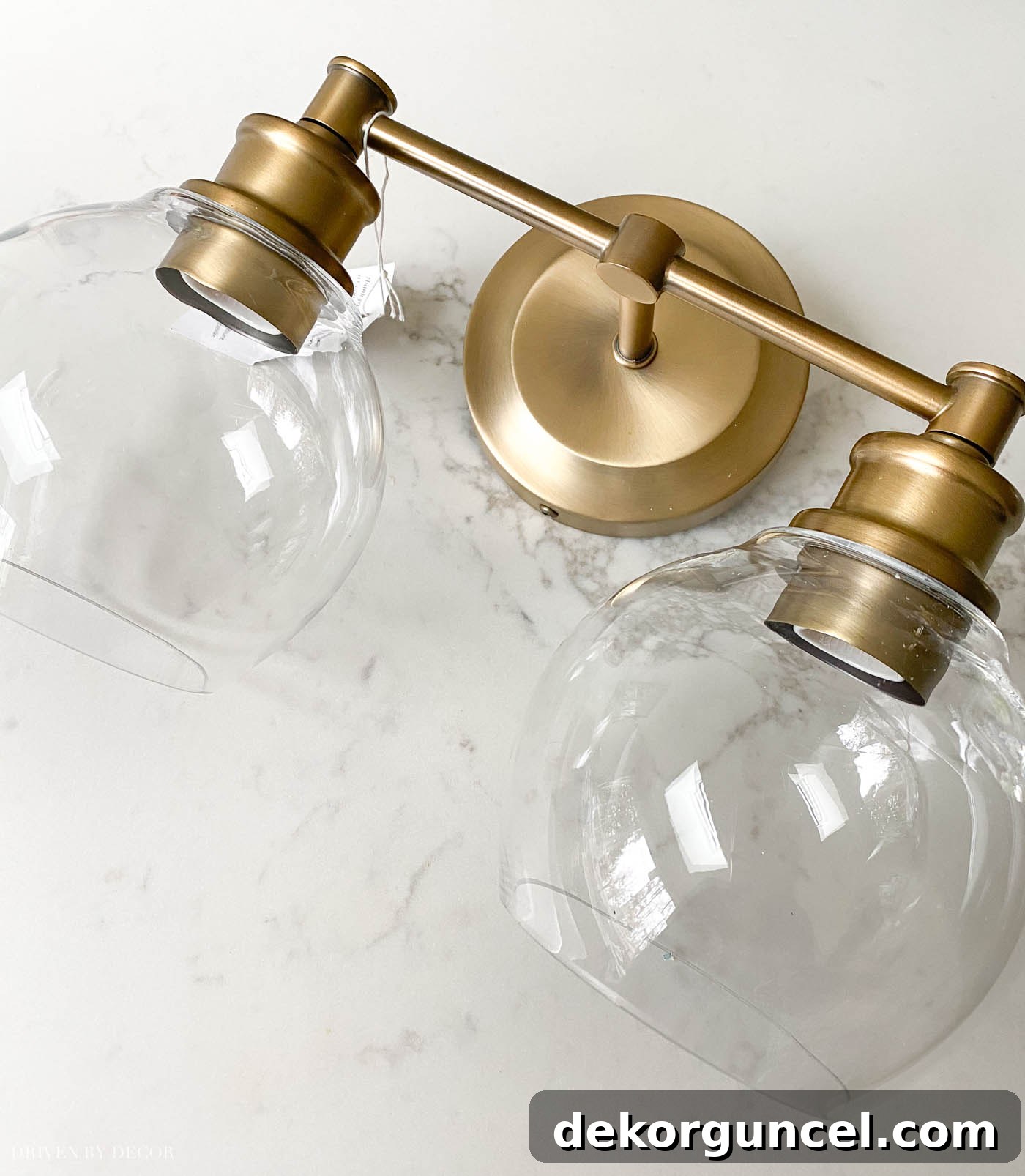 Our Bathroom Remodel Progress 17 Love these two-light brass globe lights for over a bathroom vanity mirror!