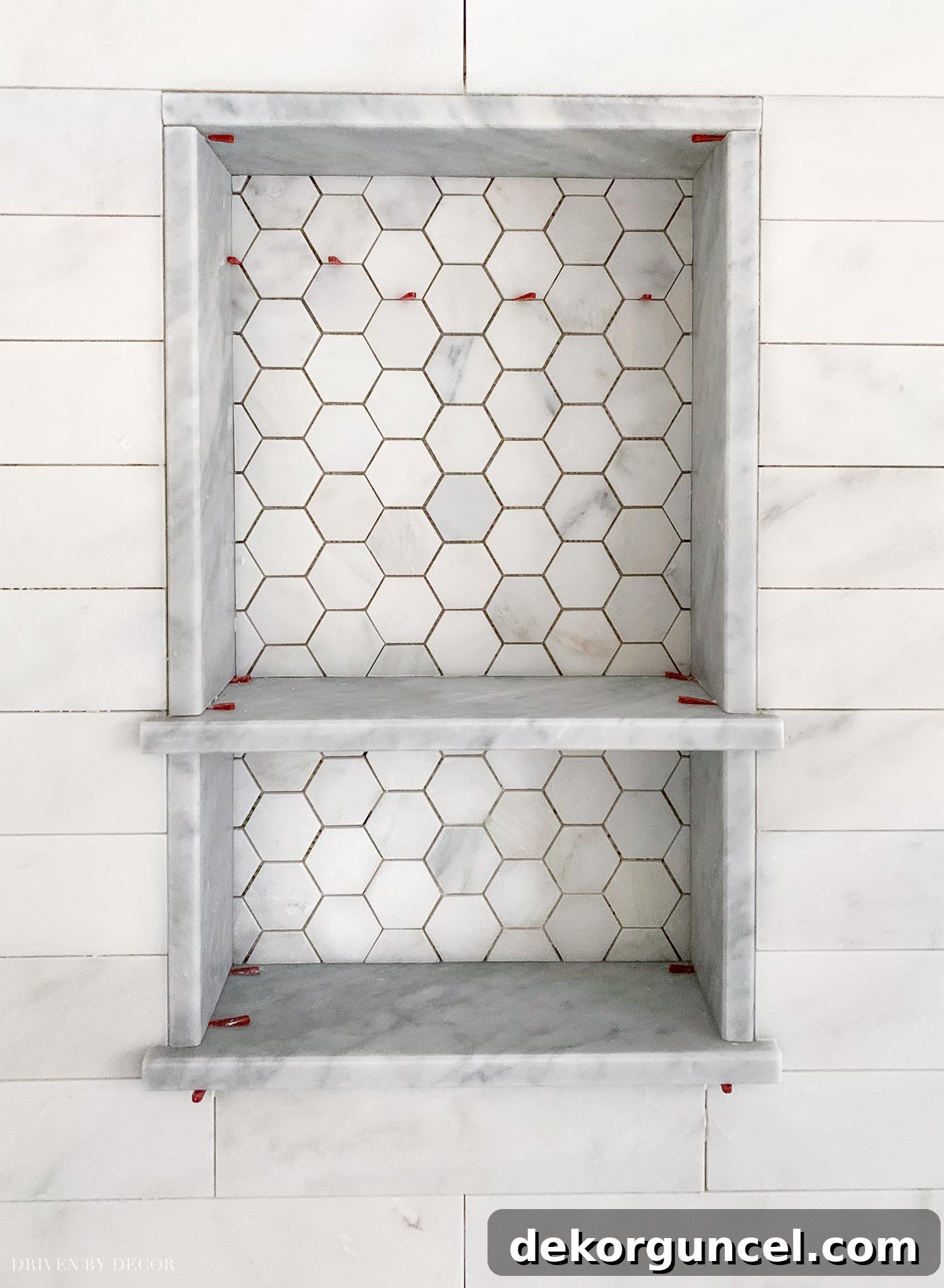Our Bathroom Remodel Progress 10 Gorgeous marble shower niche! Love the hexagon tile on the back of it!