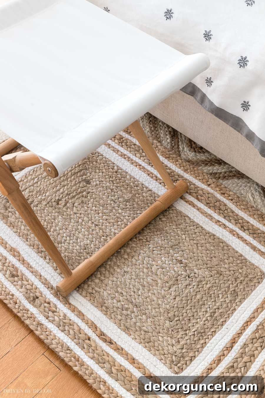Gorgeous jute rug with a sophisticated triple white border, perfect for adding subtle style to a bedroom.