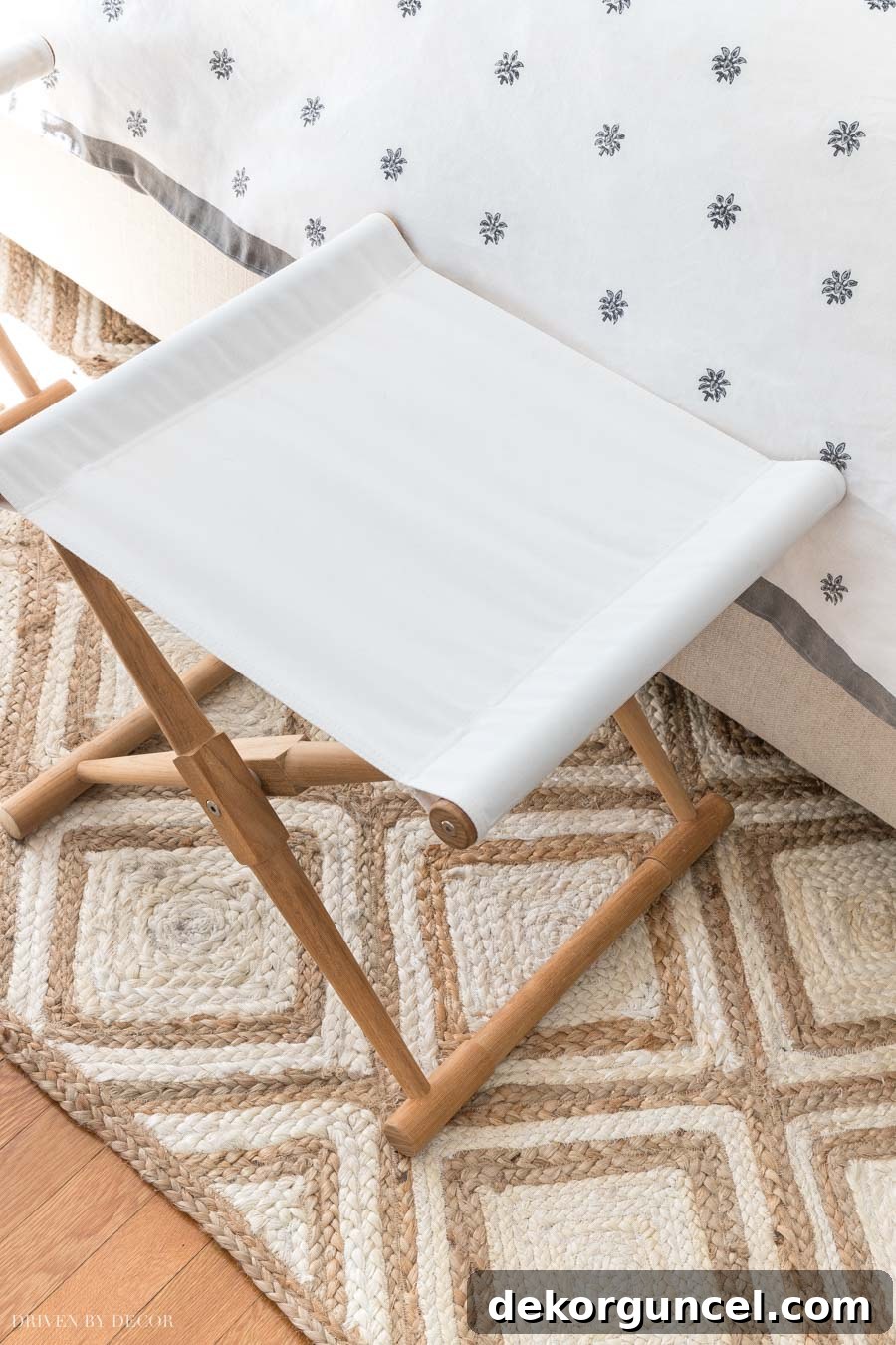 A stylish neutral patterned jute rug, ideal for bringing subtle texture and design to any bedroom decor.