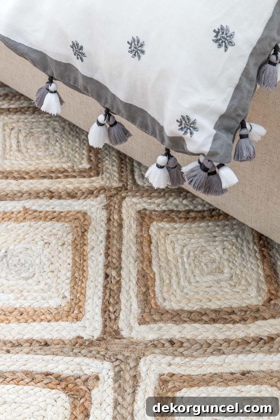 Close-up of the jute rug in the bedroom, showcasing its beautiful pattern and texture.