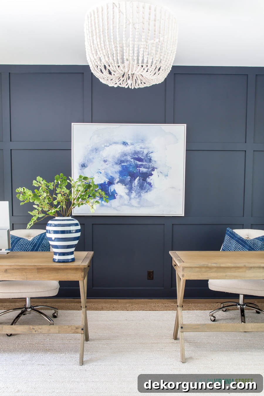 A home office featuring Benjamin Moore Hale Navy paint color on the walls, creating a striking and sophisticated look.