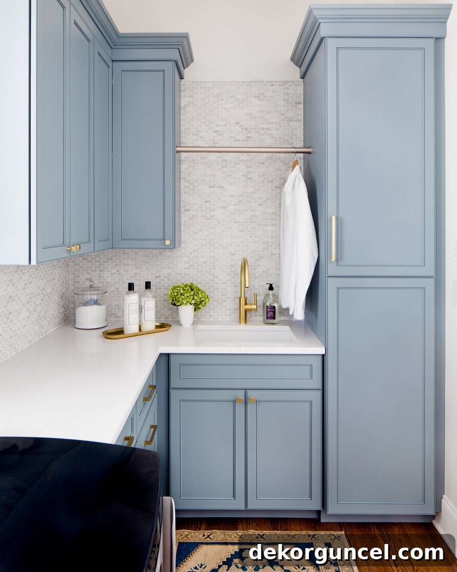 Laundry room cabinetry painted in the beautiful Benjamin Moore Van Courtland Blue, showcasing its modern versatility.