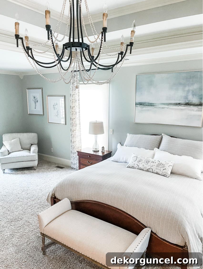 A serene bedroom designed with Benjamin Moore Beach Glass paint on the walls, enhancing a calming atmosphere.
