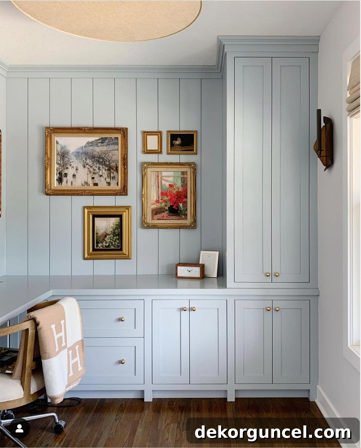Built-in cabinetry painted in Sherwin Williams Krypton, a light and atmospheric blue-gray hue.