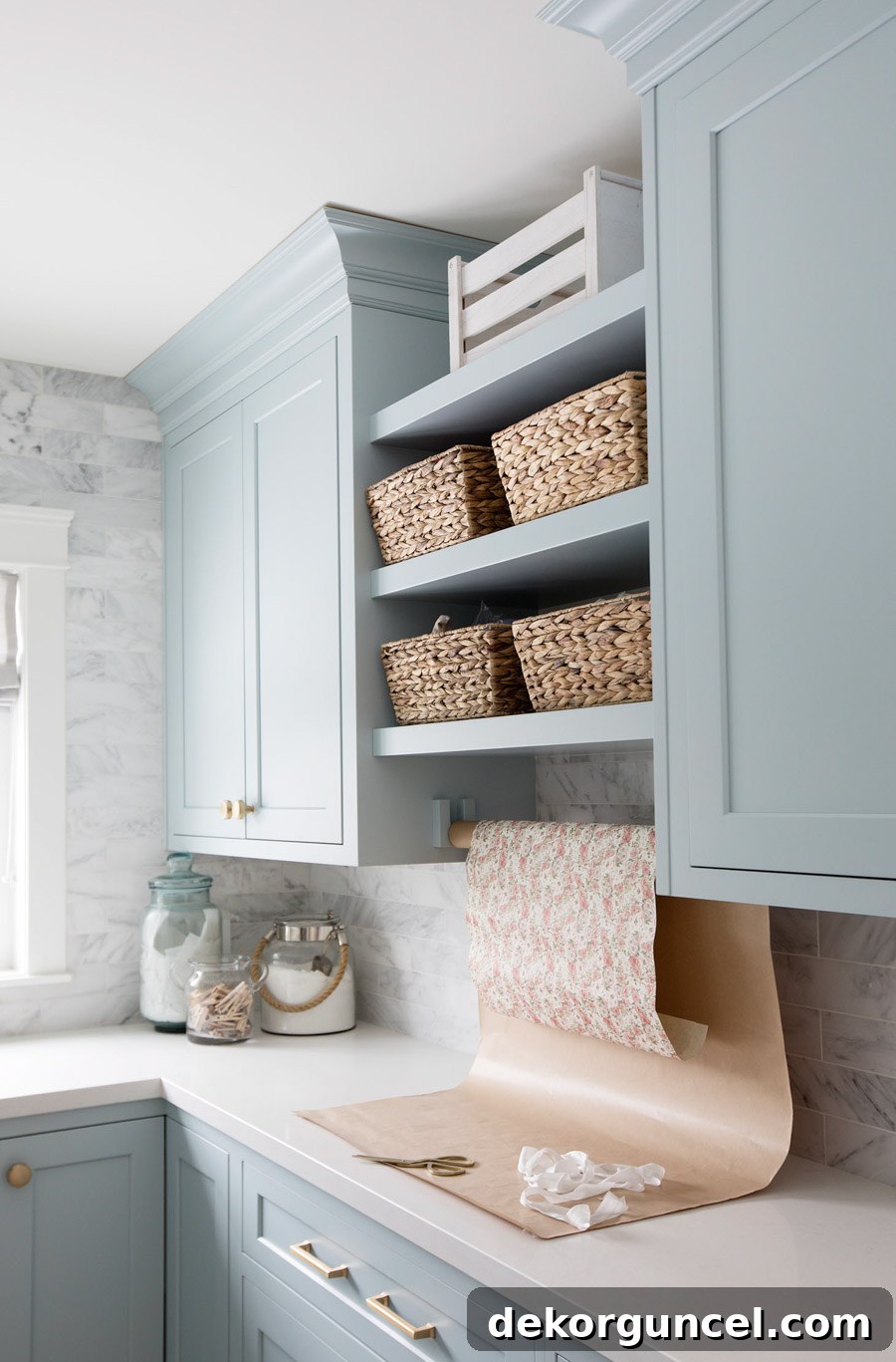 Jillian Harris's laundry room featuring Benjamin Moore Smoke paint color on the cabinetry, a gorgeous blue-gray.