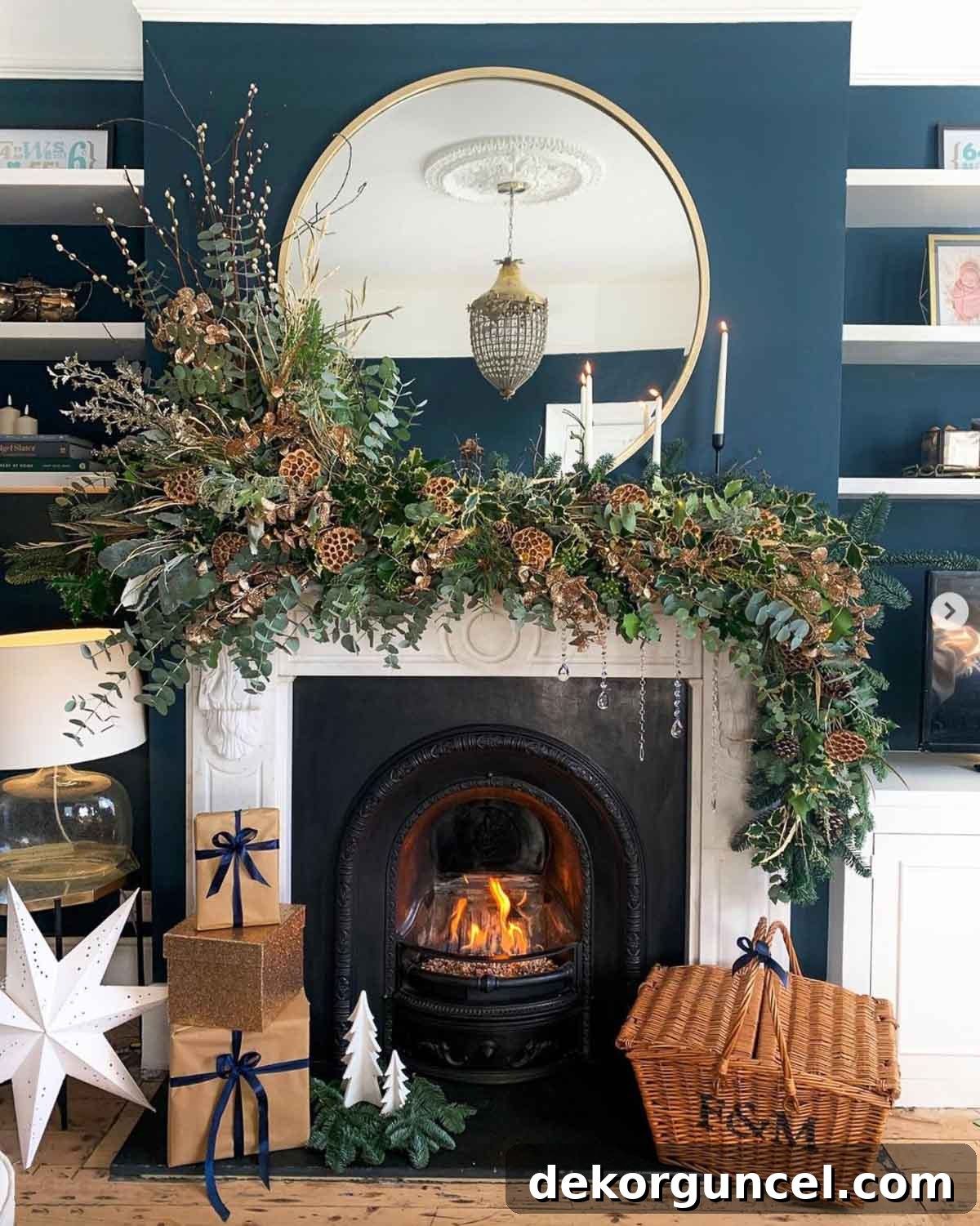 A fireplace wall beautifully painted in Farrow & Ball Hague Blue, adorned with festive holiday decor.