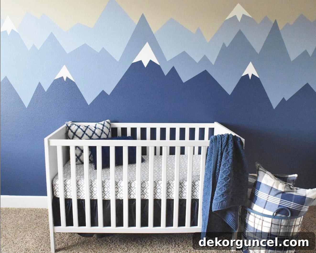 An adorable nursery featuring painted walls in beautiful shades of blue, including Sherwin Williams Indigo Batik.