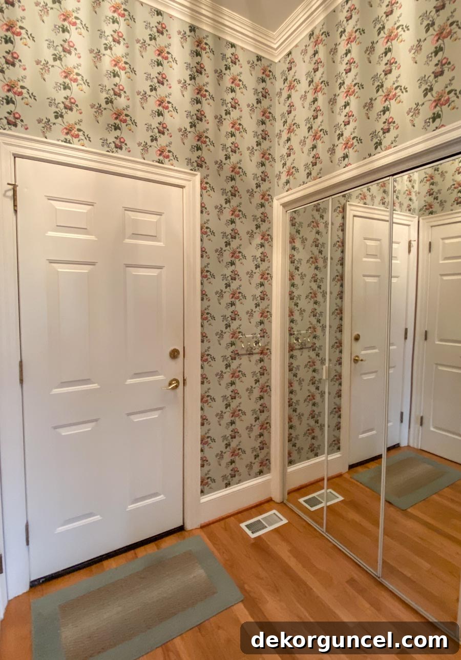 Before: Our laundry room with old, dated wallpaper that needs to be removed