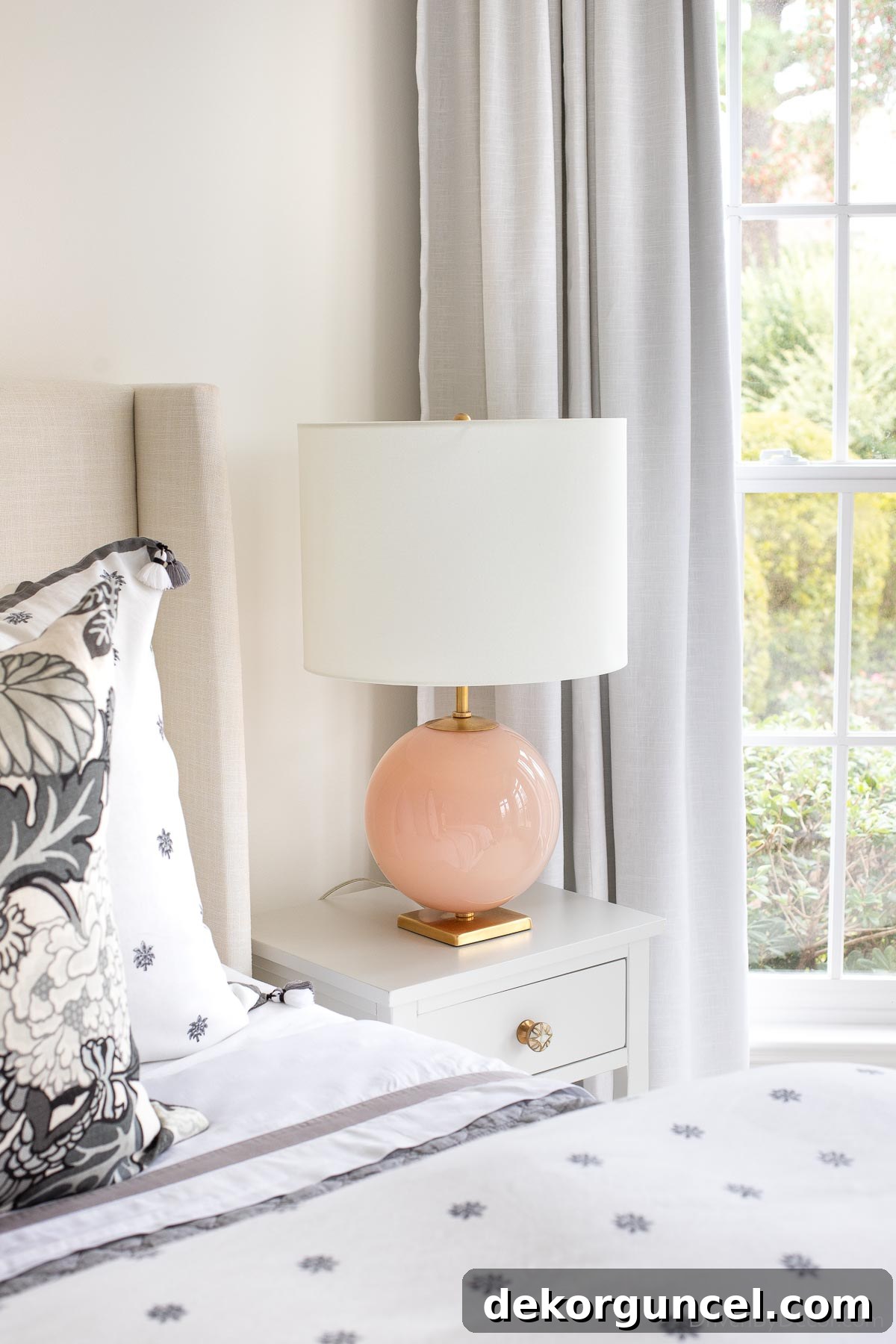 The bedroom lamps on our nightstands with a round blush base