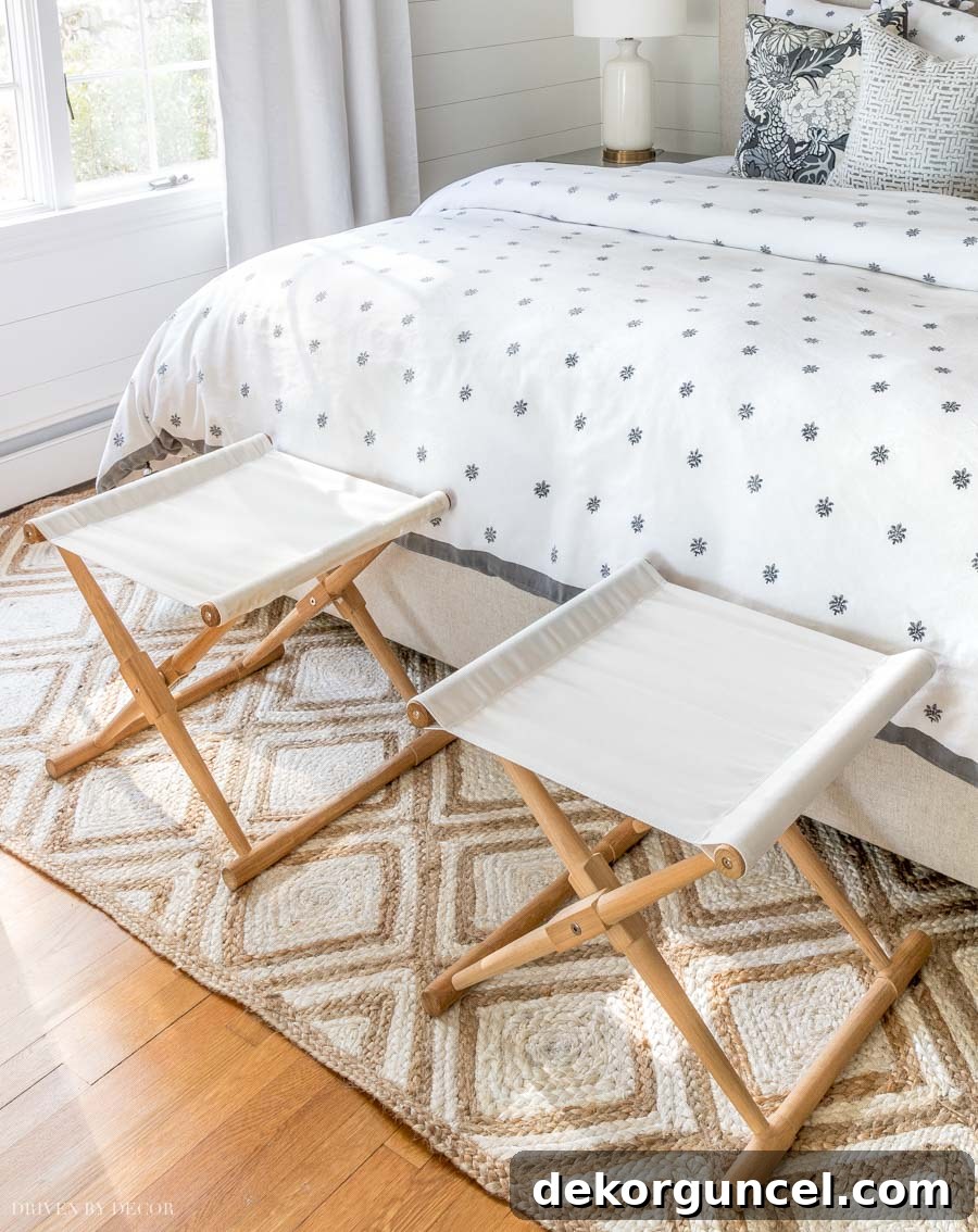 Instead of a bench at the end of the bed, I love the look of two stools like this!