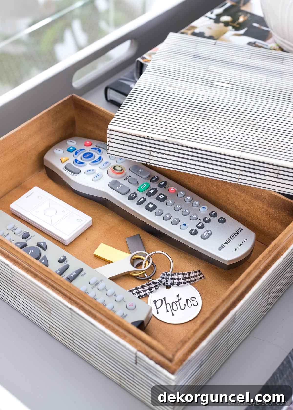20 Genius Home Organization Hacks for a Clutter-Free Home 18 Decorative box holding remotes on living room coffee table, enhancing tidiness