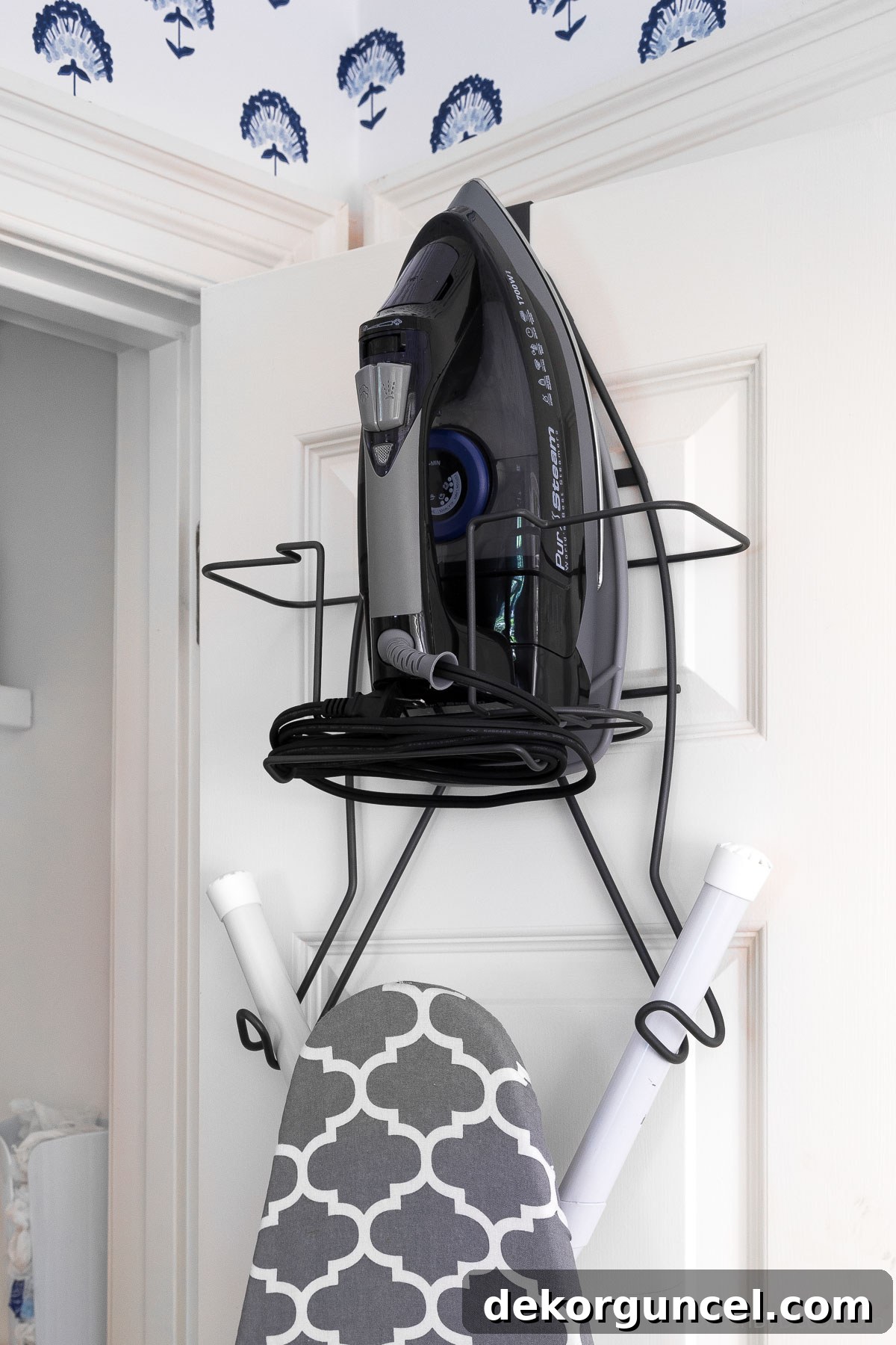 20 Genius Home Organization Hacks for a Clutter-Free Home 24 Iron and ironing board stored efficiently on the back of a closet door