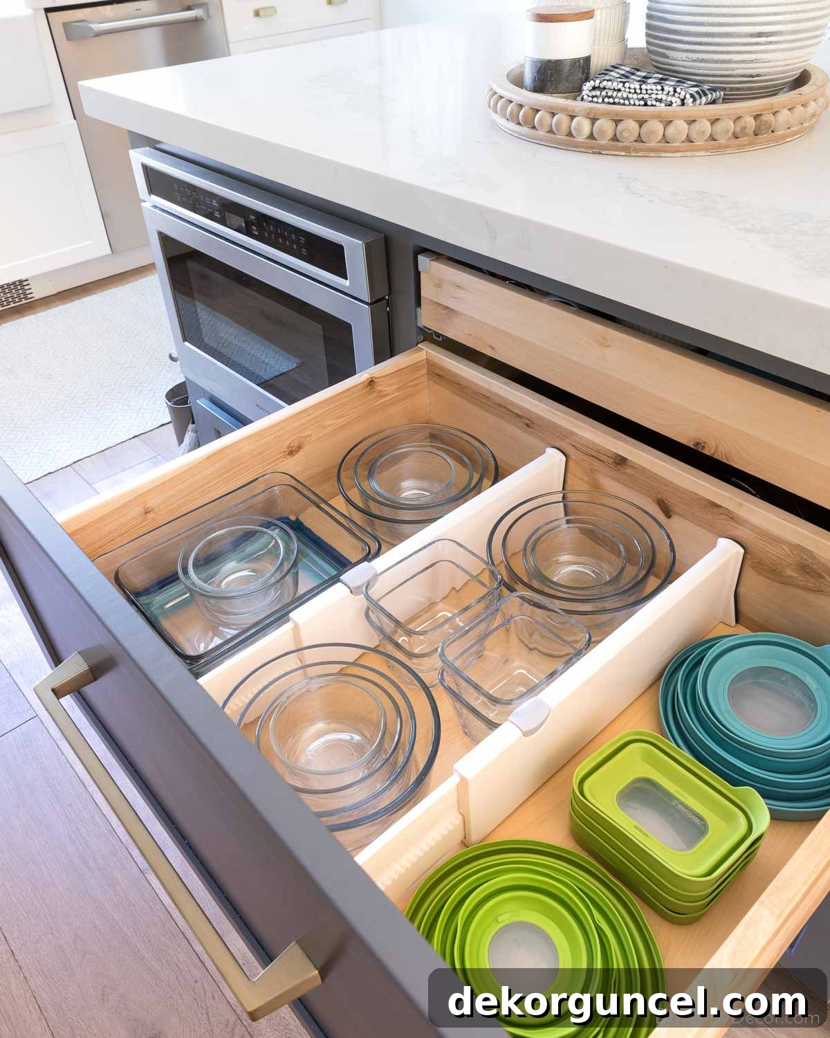 20 Genius Home Organization Hacks for a Clutter-Free Home 5 Deep kitchen drawer with adjustable dividers organizing pots and food containers