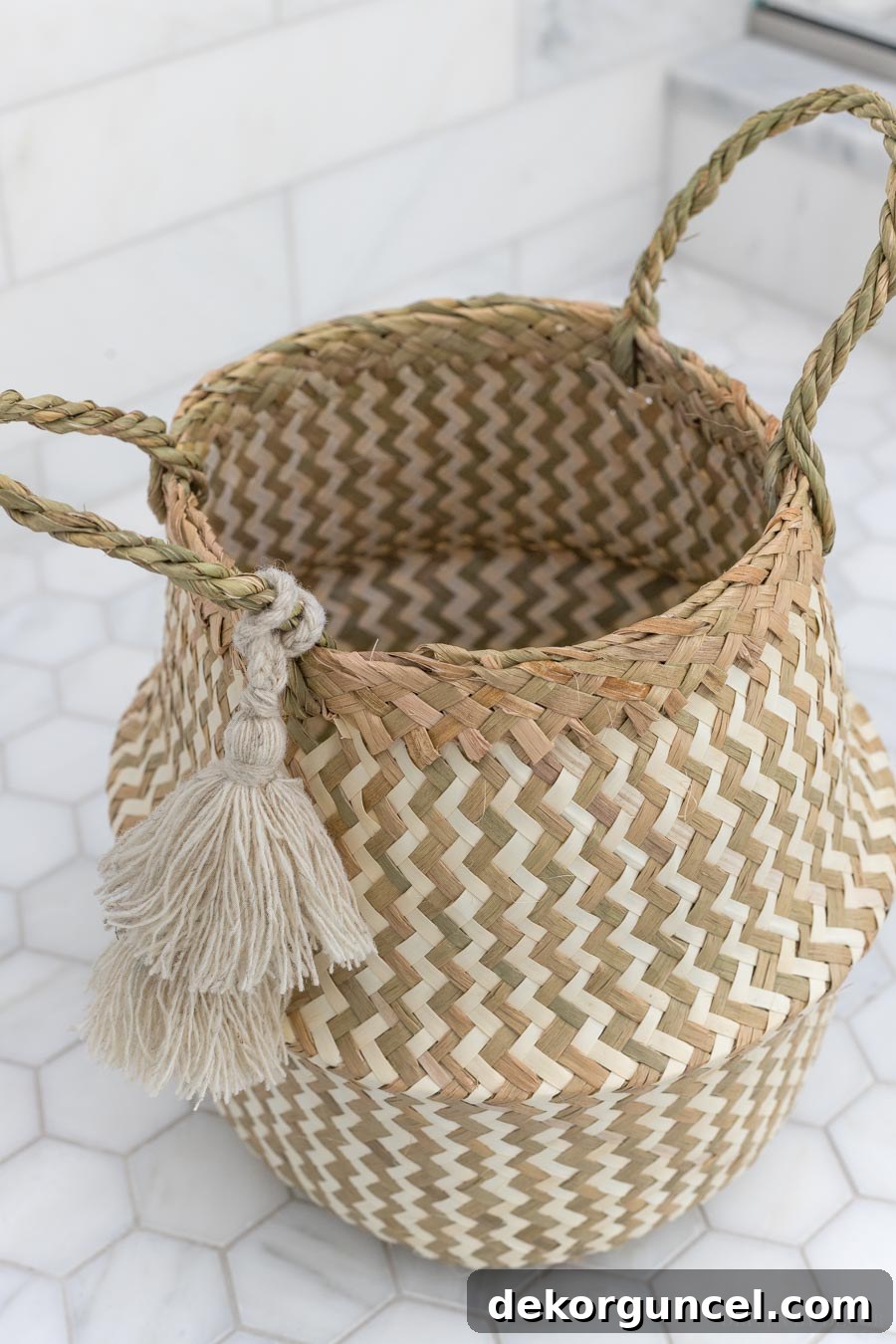Effortless Bathroom Style for an Instant Update 11 Darling woven basket with tassels used for stylish bathroom storage