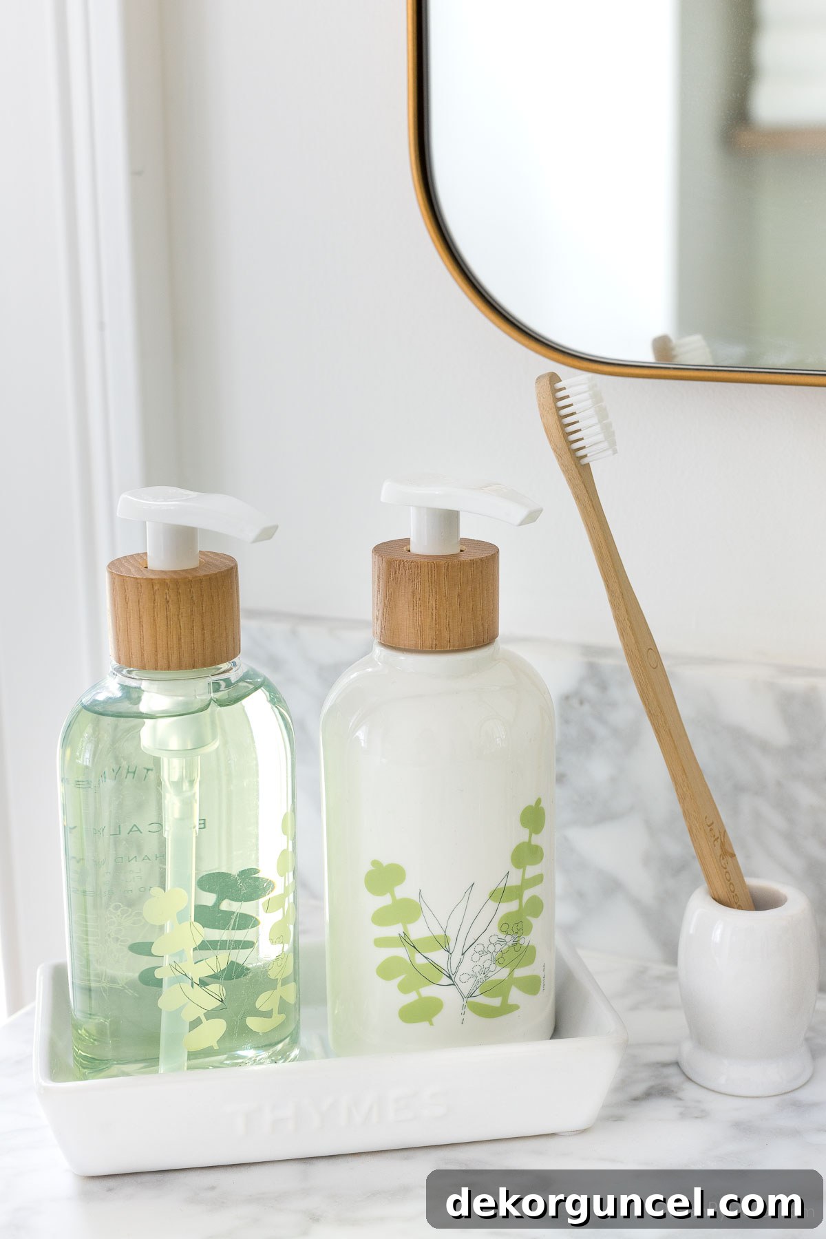 Effortless Bathroom Style for an Instant Update 7 Liquid soap and lotion pumps displayed on a ceramic tray, enhancing bathroom elegance