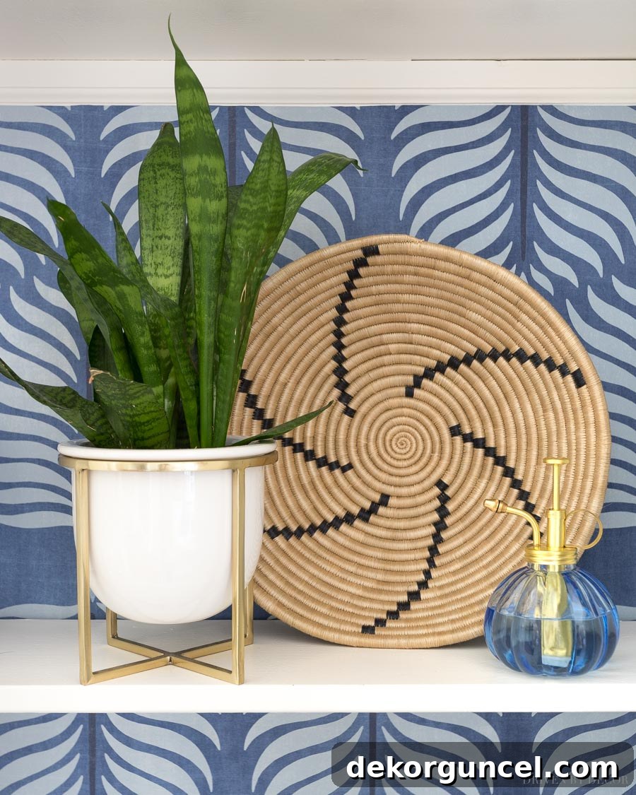 A gorgeous large woven basket, versatile for hanging on a wall or styling in a bookcase or on shelves.