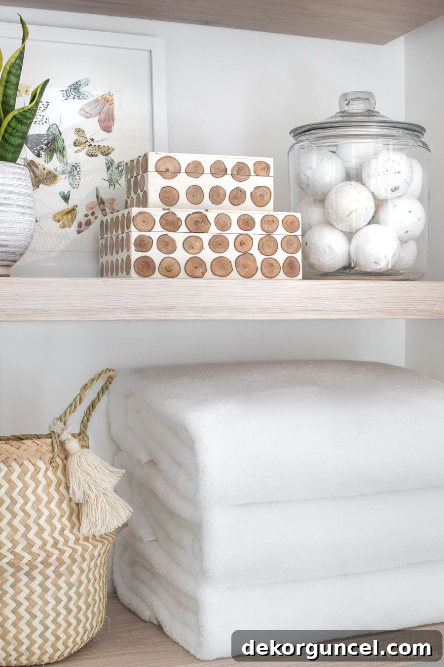Close-up of fluffy bath towels neatly folded on the floating shelves, ready for use