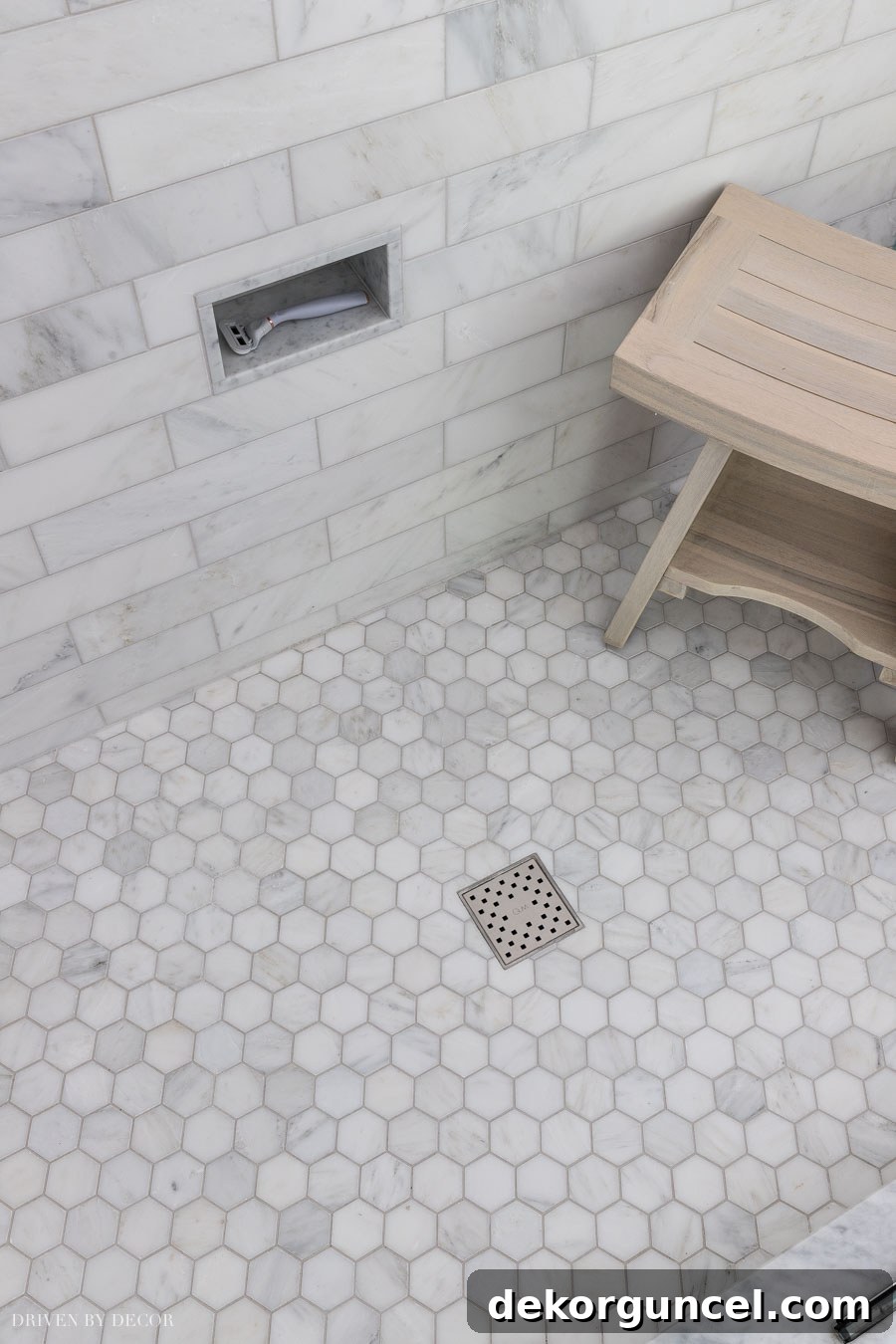 Close-up of our marble hexagon shower floor, showcasing the beautiful Bianco Bello tile
