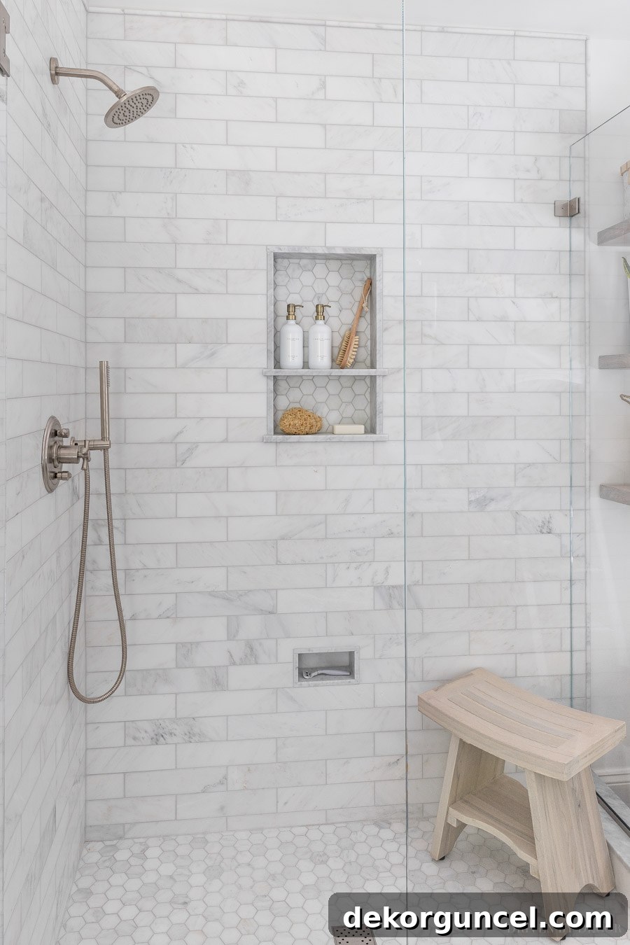 Luxurious marble master bathroom shower with elegant satin nickel fixtures