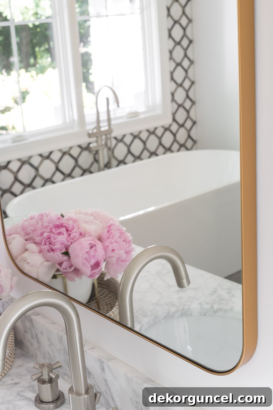 Large rectangular bathroom mirror with a thin gold edge, reflecting subtle luxury