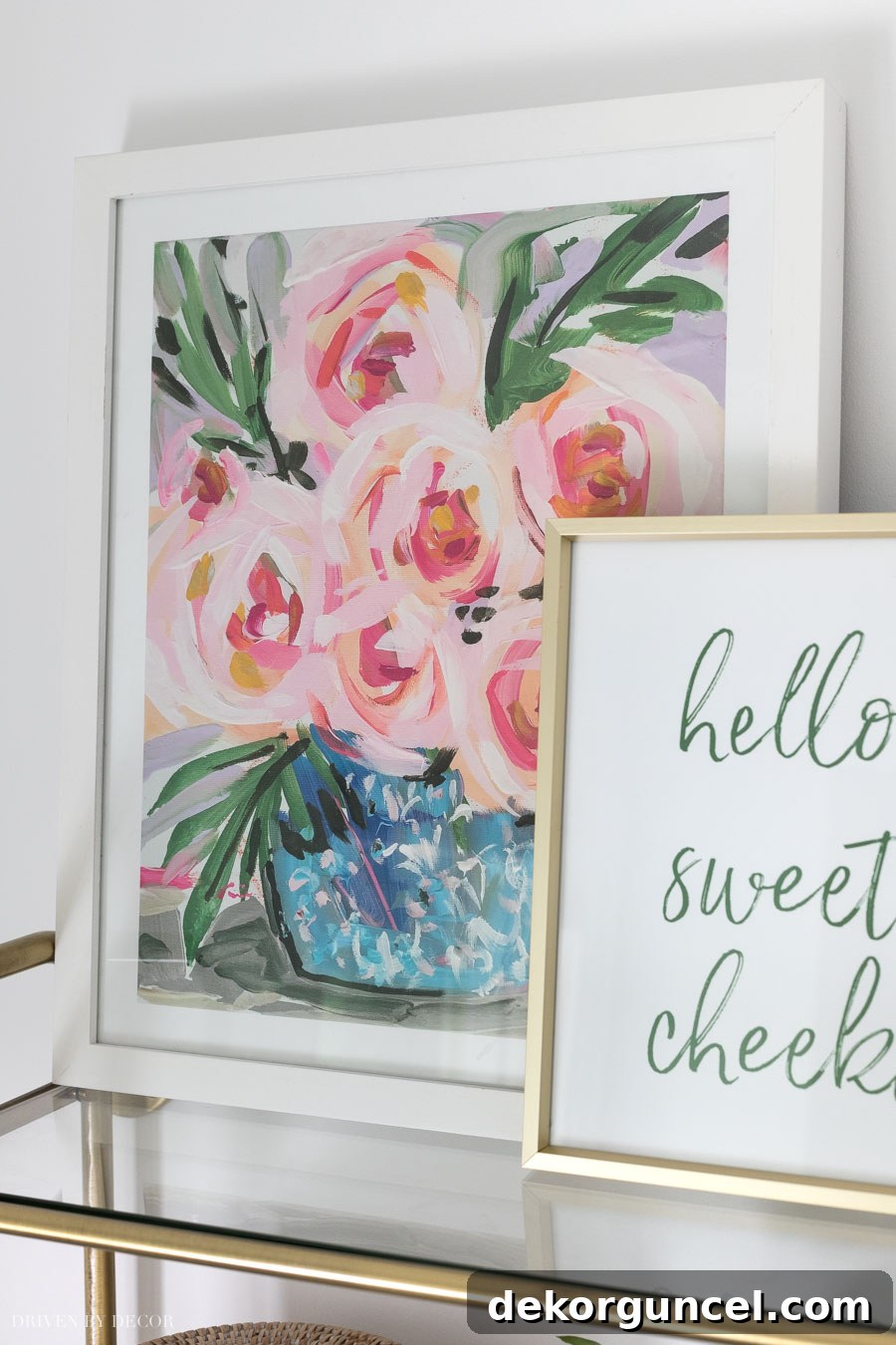 Beautiful floral art print in a white frame, adding elegance to the water closet