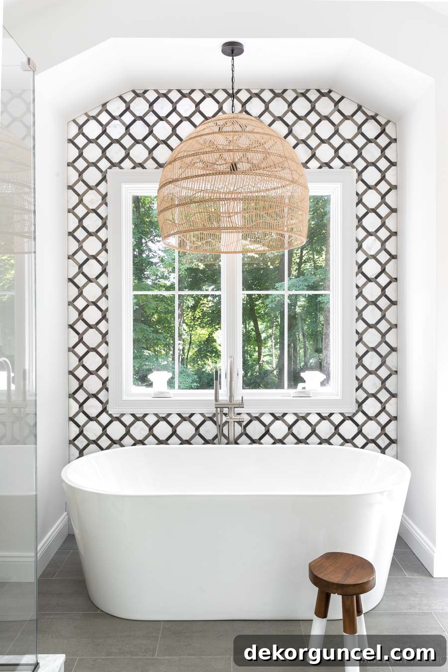 The stunning freestanding tub in our master bathroom, set against an exquisite statement tile wall