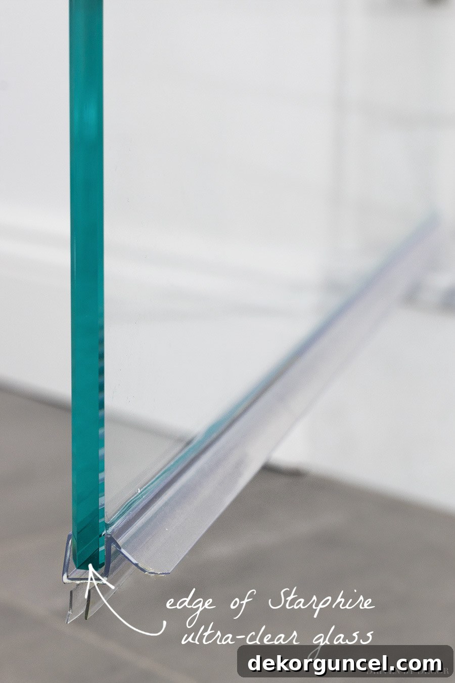 Glass Shower Enclosures What To Pay And What To Skip 6 Comparison illustrating the distinct bluish tint of low-iron ultra-clear glass edges versus the green of regular glass.